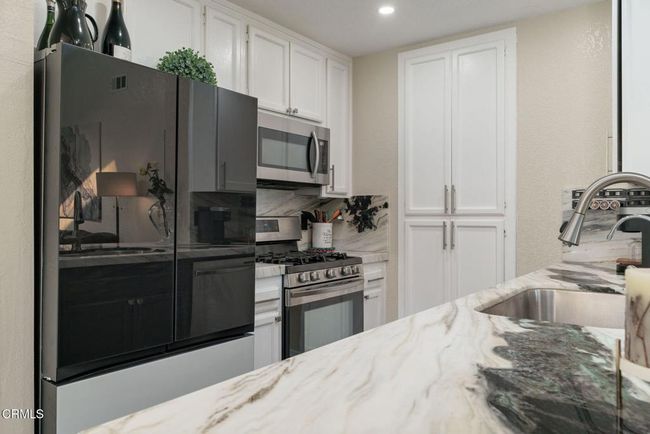 Kitchen with Marble Countertops | Image 18
