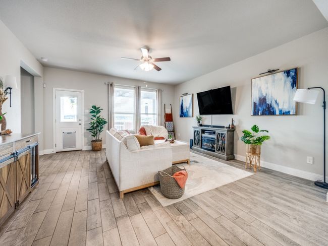 Living area is a thoughtful layout with an airy design to create a welcoming atmosphere that feels both spacious and connected! | Image 4