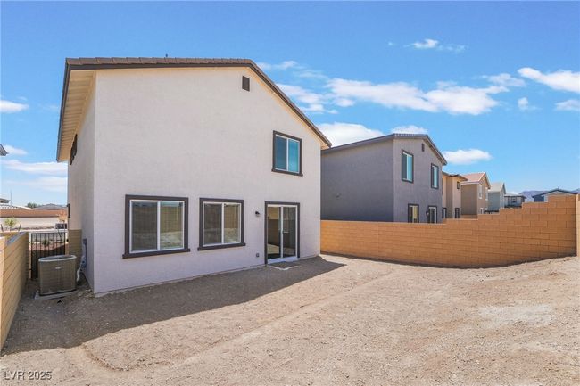 Rear view of property featuring a fenced backyard and stucco siding | Image 35