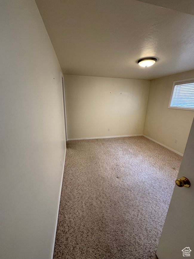 Carpeted empty room with baseboards | Image 16