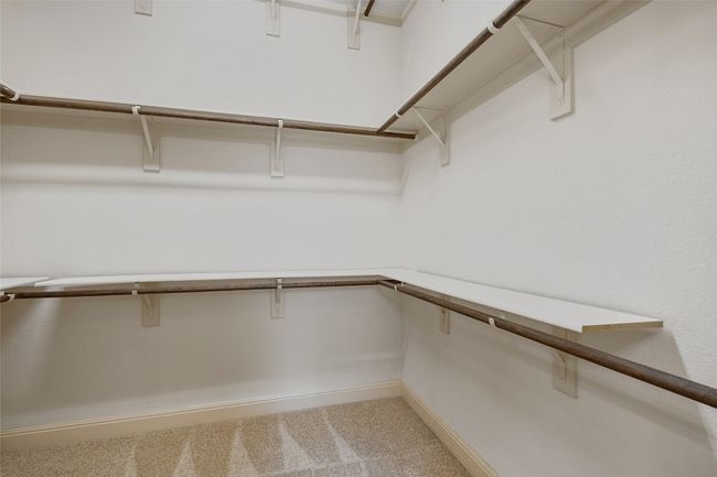 Spacious closet with carpet flooring | Image 33