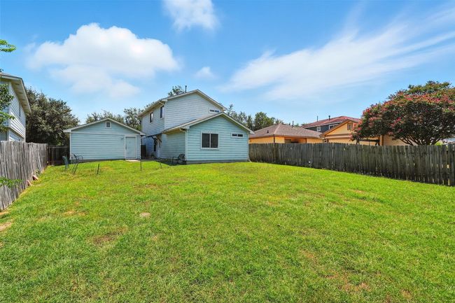 Back of property featuring a fenced backyard | Image 26
