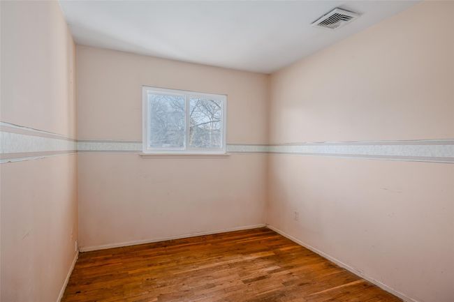 Spare room featuring wood-type flooring and visible vents | Image 20