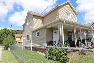 Front and Left Side view of the home. Fully chain linked fence around entire yard. | Image 2