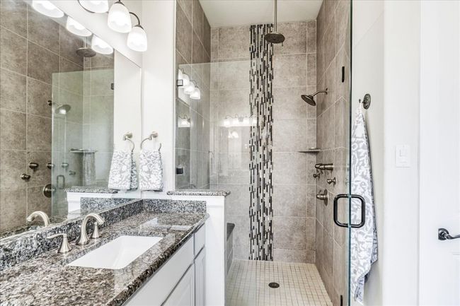 Full bath featuring a stall shower and vanity | Image 20