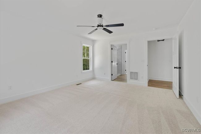 Unfurnished bedroom with baseboards, carpet flooring, visible vents, and a ceiling fan | Image 18