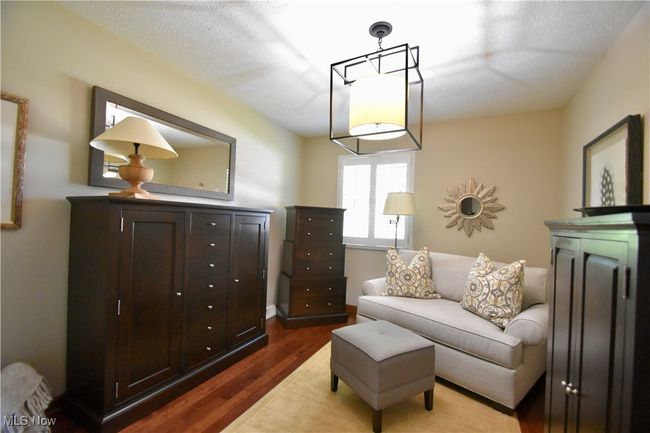 Bedroom featuring dark wood-type flooring | Image 16