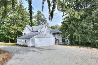 56 Wright St owns the private road leading to the house and beyond. The circular gravel driveway shows the garage and the house in the rear | Image 3