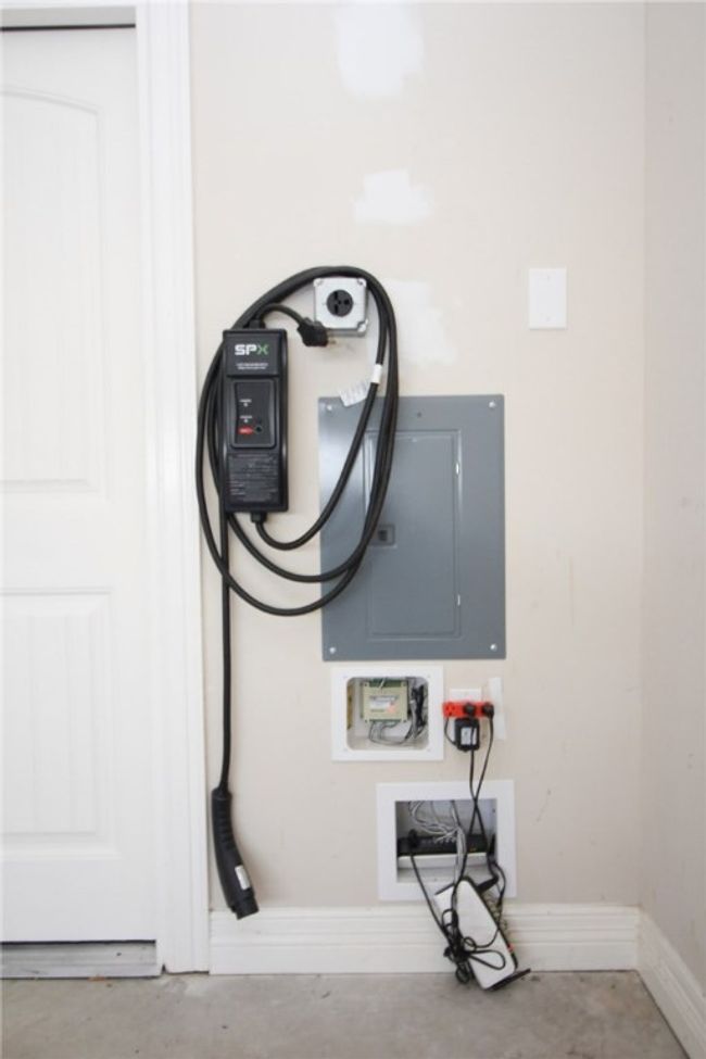Car charging station in garage. | Image 36