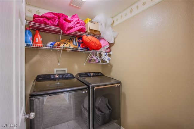 Laundry room with washing machine and dryer | Image 10