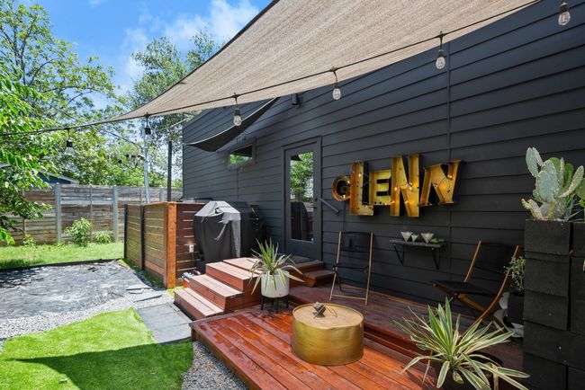Wooden deck featuring area for grilling and a patio | Image 34