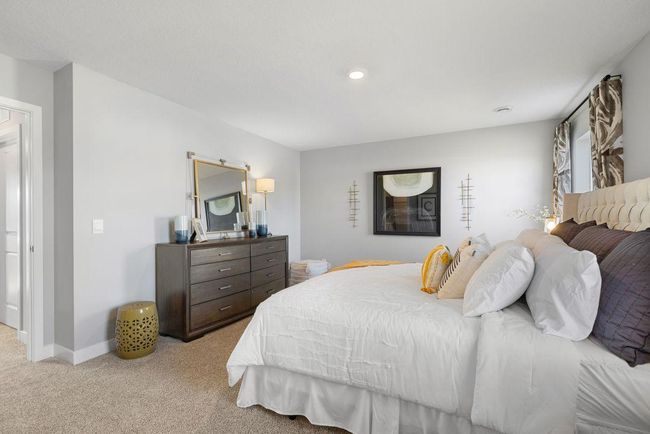 Owner's suite is large enough for a King bed and more. Photo is of Model home. Colors and options may vary. Ask Sales Agent for details. | Image 22