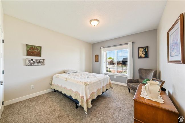 Carpeted bedroom featuring baseboards | Image 31