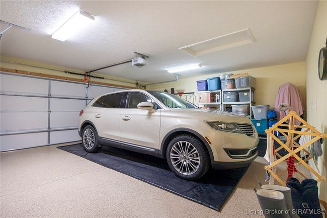 Large garage with access to attic configured for pull dowb stairs | Image 47