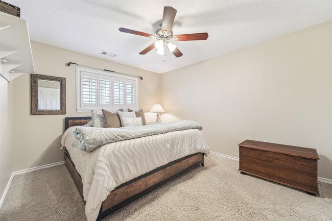 Spacious secondary bedroom featuring a generous walk-in closet. | Image 24