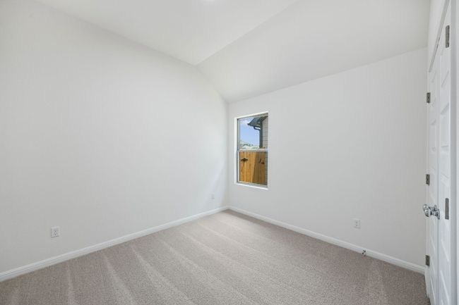Empty room featuring light colored carpet and vaulted ceiling | Image 27