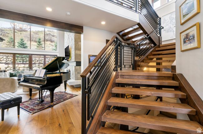 Stairs featuring a high ceiling, recessed lighting, and hardwood / wood-style floors | Image 9