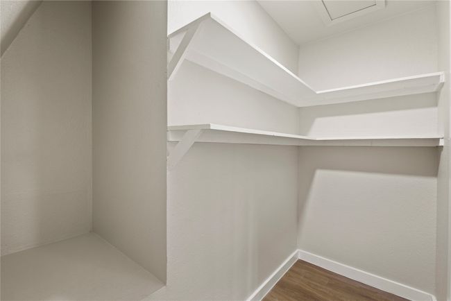 Spacious closet featuring dark wood finished floors | Image 12