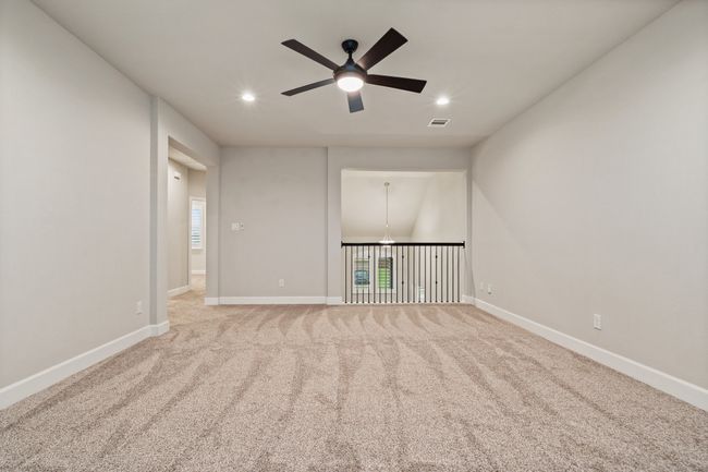 Spare room with ceiling fan, recessed lighting, carpet, and a chandelier | Image 17