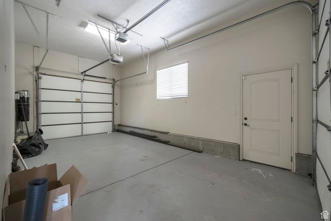 Garage with a garage door opener | Image 36