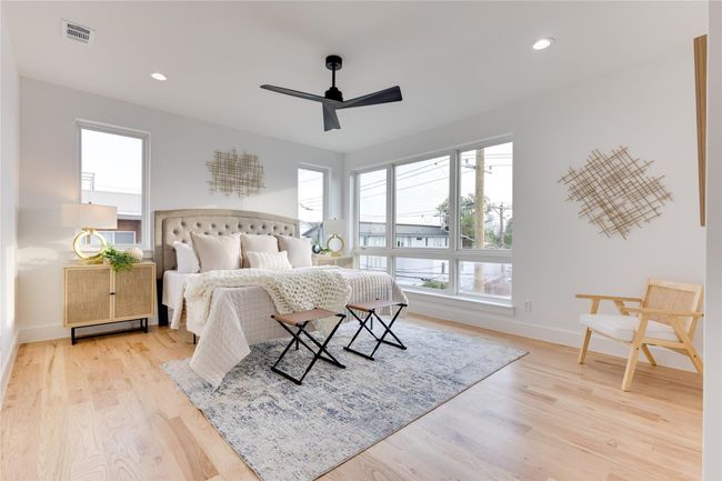 Bedroom featuring ceiling fan and light wood-type flooring | Image 23