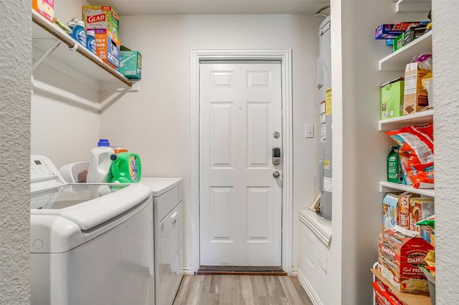 Laundry area featuring separate washer and dryer and vinyl floors | Image 17