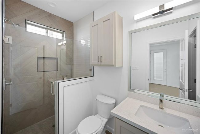 Full bathroom featuring vanity and a shower stall | Image 16