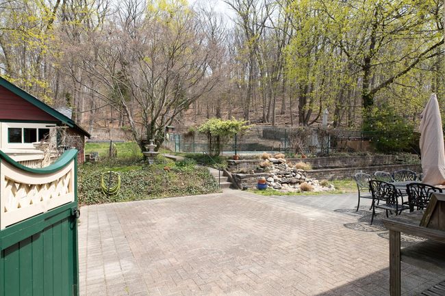 View of patio / terrace featuring a fenced backyard and outdoor dining space | Image 31