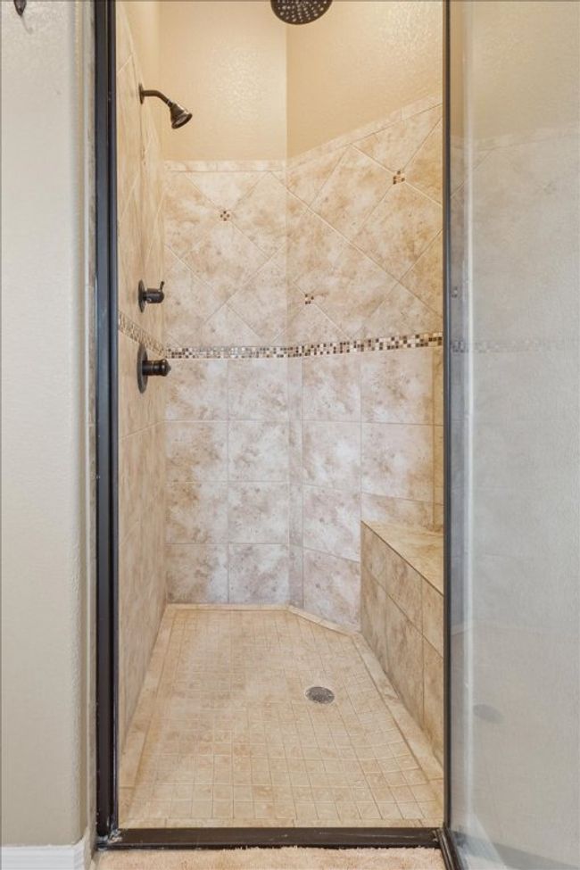 Bathroom with a shower stall | Image 25