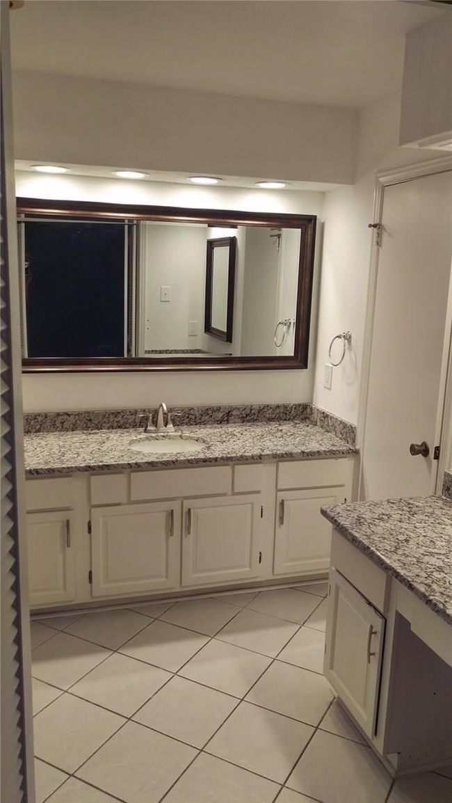 Bathroom with vanity and tile patterned floors | Image 8