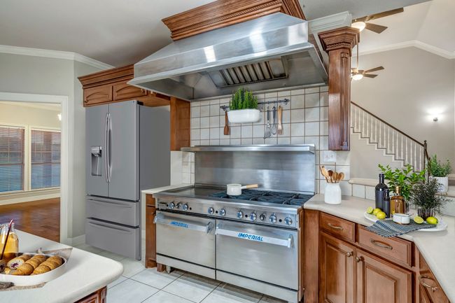 Virtually staged kitchen. Frig is actually built for a commercial refrigerator. | Image 18