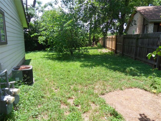 View of yard featuring central AC | Image 15
