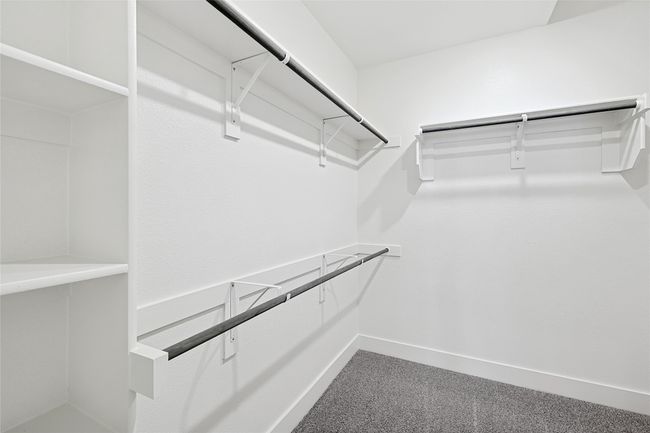 Walk in closet with carpet flooring | Image 23