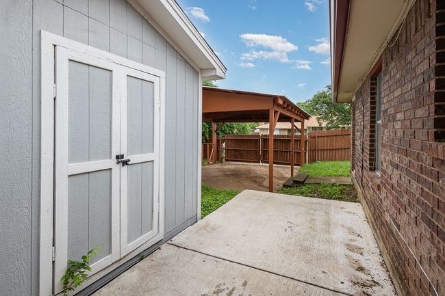 View of patio / terrace with fence, an outbuilding, and a shed | Image 21