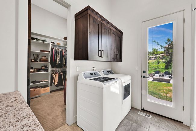Laundry room with cabinet space and separate washer and dryer | Image 86