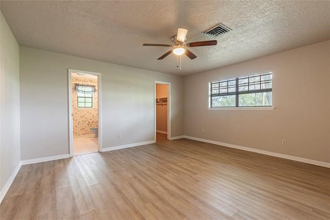 This is the original primary in the main house with its own walk in closet and ensuite bath | Image 11