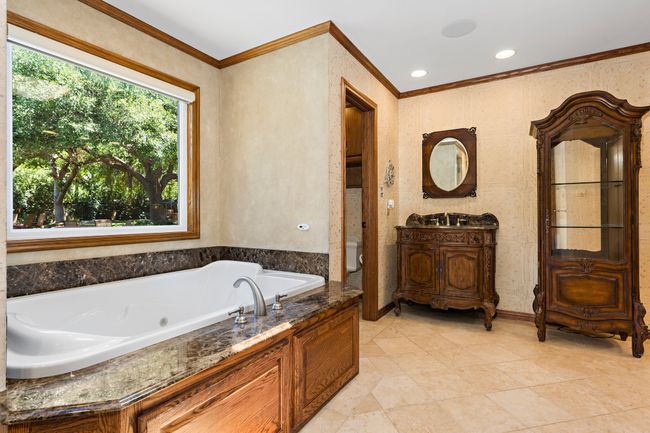 Master bath with jetted tub & French vanity | Image 13