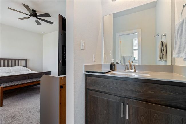 Ensuite bathroom featuring ensuite bathroom, vanity, and a ceiling fan | Image 33