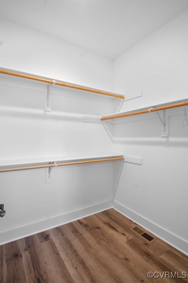Spacious closet with visible vents and wood finished floors | Image 19