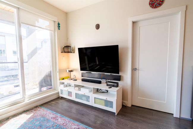 Living room featuring dark wood-style flooring | Image 8