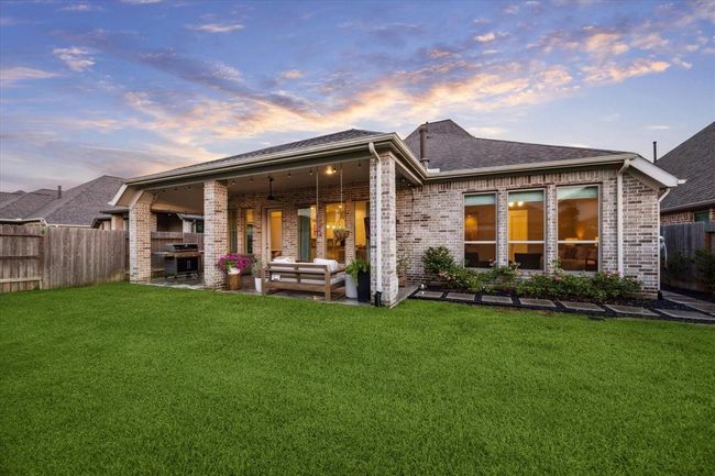 Meticulous craftsmanship shines inside and out, with thoughtful details throughout this energy-efficient home that blends modern sophistication with lasting quality. The spacious backyard provides ample room for relaxation and entertaining, with space available to accommodate the addition of a custom pool. | Image 30