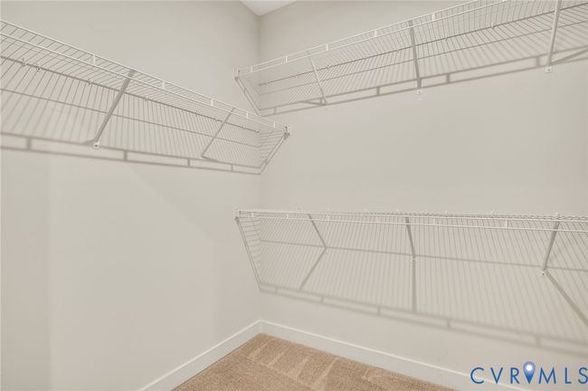 Spacious closet with carpet | Image 18