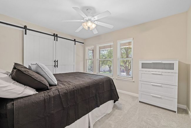 Each guest bedroom is generously sized with large windows that bring in natural light. | Image 27