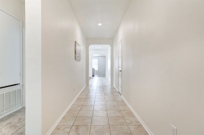 walkway from the front door to secondary bedrooms and living area | Image 6