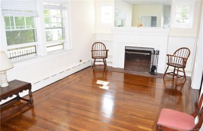 Hardwood floors and fireplace. | Image 3