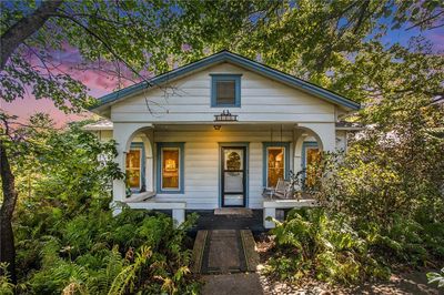 Bungalow featuring a porch | Image 1