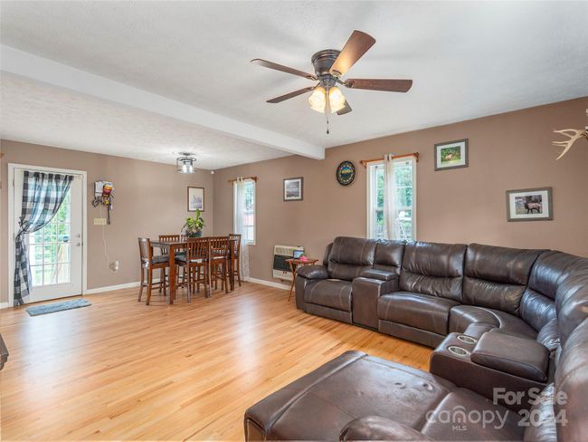 Gleaming hardwoods, abundant natural light, all as part of the family room and dining area | Image 5