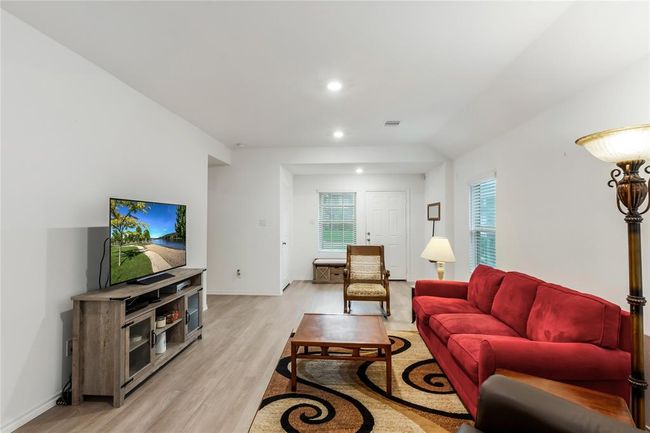 Another warm look at the living room, with ample wall space for photos, art, or a big-screen TV. | Image 6