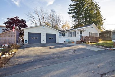 Single story home with a deck and a garage | Image 2