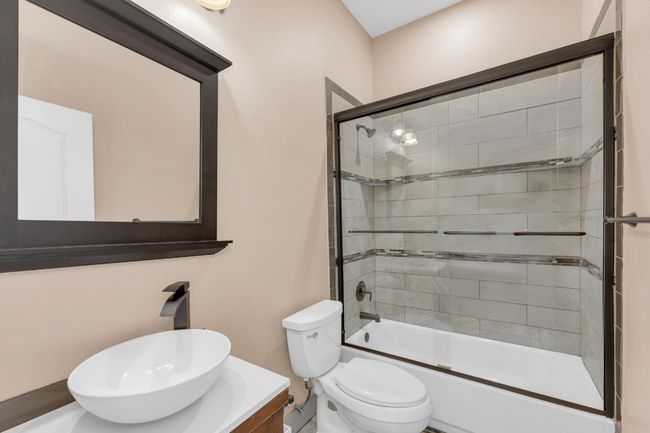 Full bath with vanity and shower / bath combination with glass door | Image 26